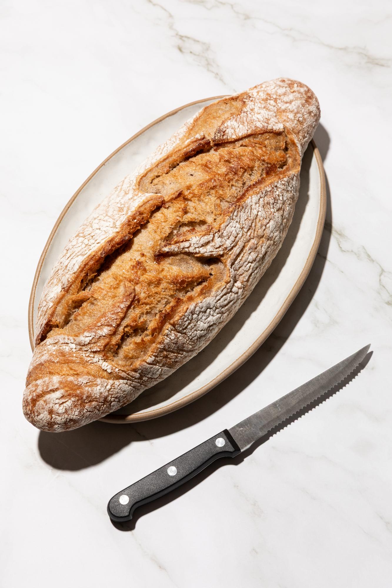 Close-up of sourdough loaf scoring
